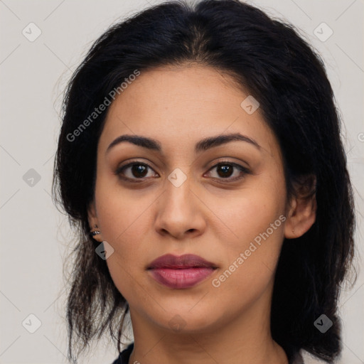 Joyful latino young-adult female with long  black hair and brown eyes