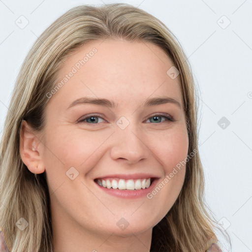 Joyful white young-adult female with long  brown hair and blue eyes