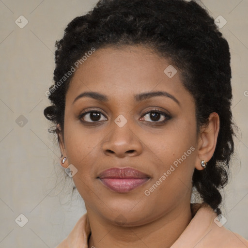 Joyful black young-adult female with long  brown hair and brown eyes