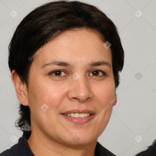 Joyful white adult female with medium  brown hair and brown eyes