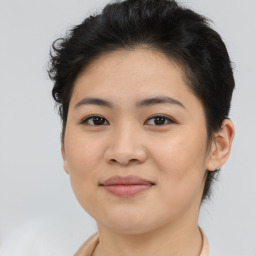 Joyful asian young-adult female with short  brown hair and brown eyes