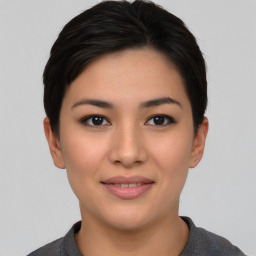 Joyful asian young-adult female with short  black hair and brown eyes