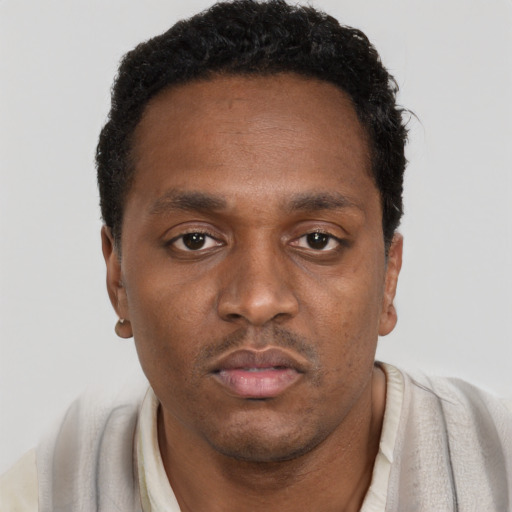 Neutral black young-adult male with short  black hair and brown eyes