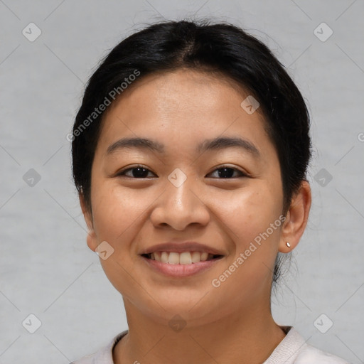 Joyful asian young-adult female with short  brown hair and brown eyes