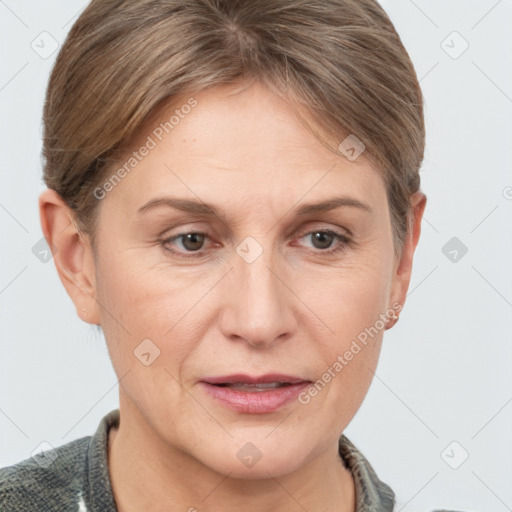 Joyful white adult female with short  brown hair and grey eyes