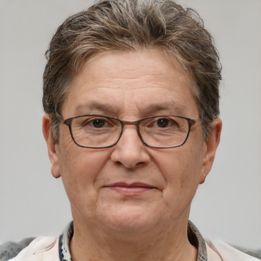 Joyful white middle-aged female with short  brown hair and grey eyes