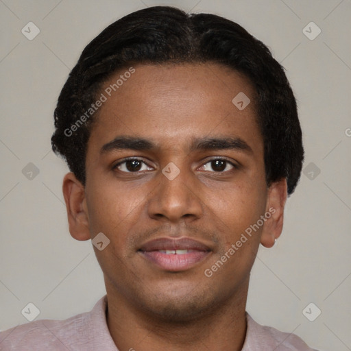 Joyful black young-adult male with short  brown hair and brown eyes