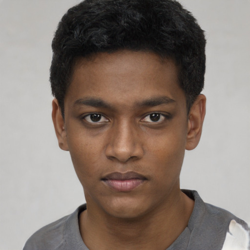 Neutral black young-adult male with short  black hair and brown eyes