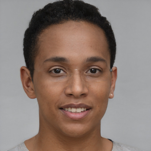 Joyful black young-adult male with short  brown hair and brown eyes