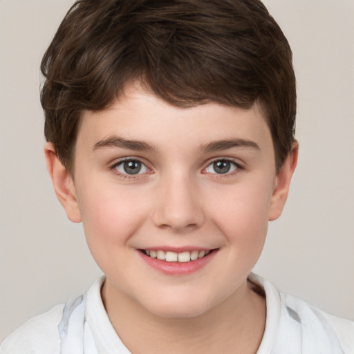 Joyful white child male with short  brown hair and brown eyes