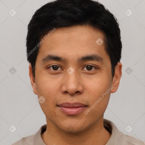 Joyful asian young-adult male with short  black hair and brown eyes