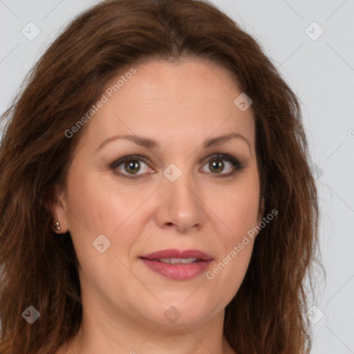 Joyful white adult female with long  brown hair and brown eyes