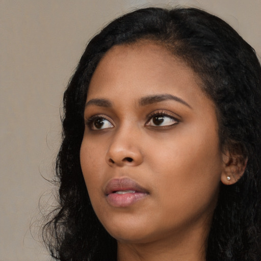 Neutral black young-adult female with long  black hair and brown eyes