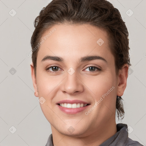 Joyful white young-adult female with short  brown hair and brown eyes