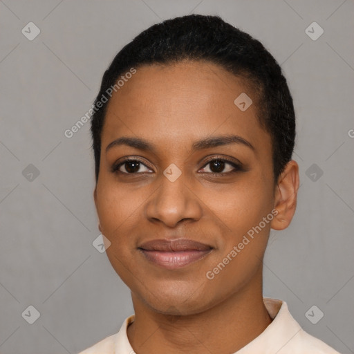 Joyful black young-adult female with short  black hair and brown eyes