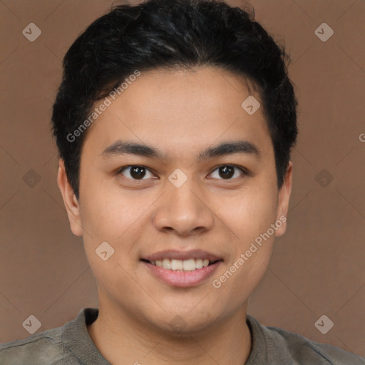 Joyful latino young-adult male with short  brown hair and brown eyes