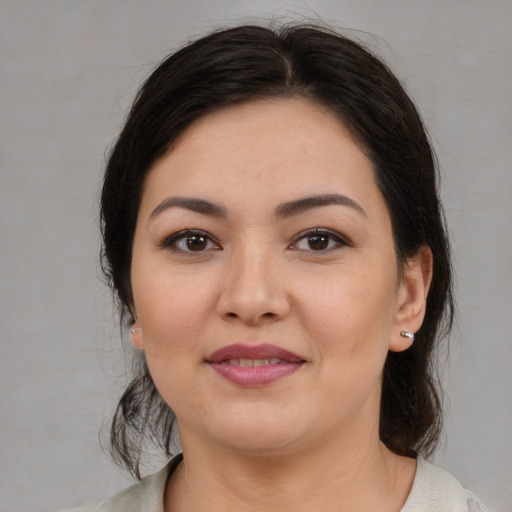 Joyful white young-adult female with medium  brown hair and brown eyes