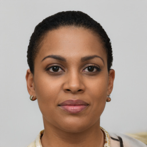 Joyful latino young-adult female with short  brown hair and brown eyes