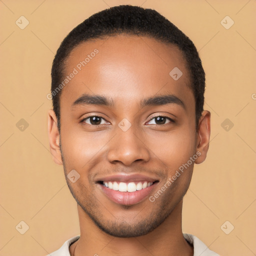 Joyful latino young-adult male with short  brown hair and brown eyes