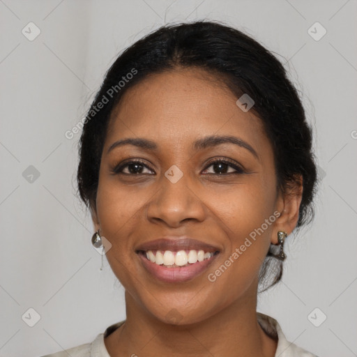 Joyful black young-adult female with medium  black hair and brown eyes