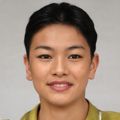 Joyful asian young-adult female with short  brown hair and brown eyes