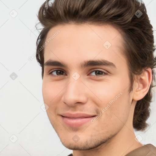 Joyful white young-adult male with medium  brown hair and brown eyes