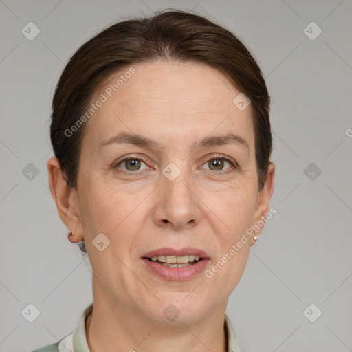 Joyful white adult female with short  brown hair and grey eyes