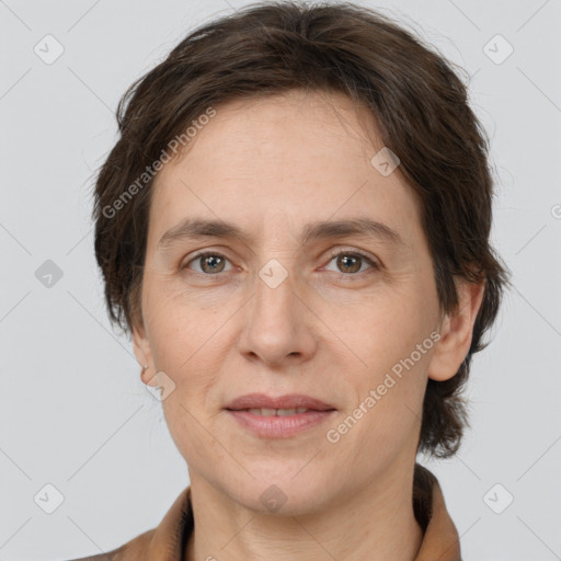 Joyful white adult female with short  brown hair and brown eyes