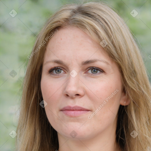 Joyful white young-adult female with long  brown hair and green eyes