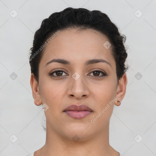 Joyful latino young-adult female with short  brown hair and brown eyes