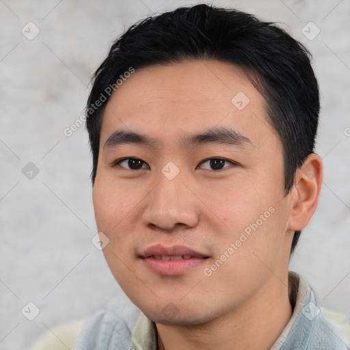 Joyful asian young-adult male with short  black hair and brown eyes