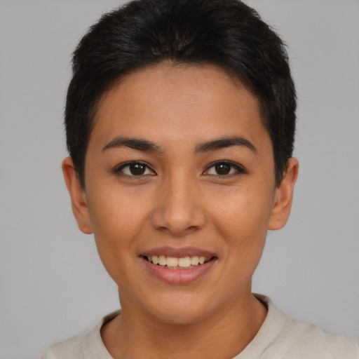 Joyful asian young-adult female with short  brown hair and brown eyes