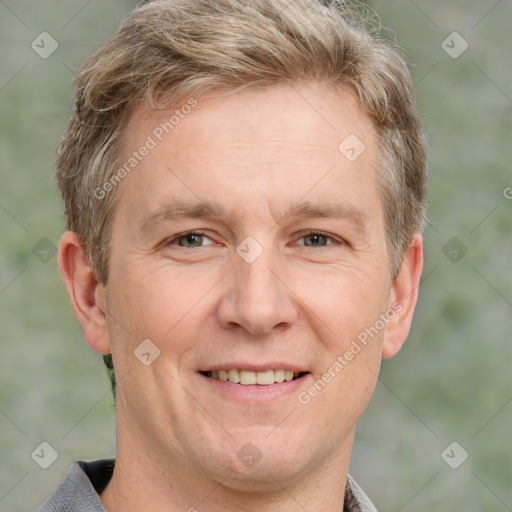 Joyful white adult male with short  brown hair and grey eyes