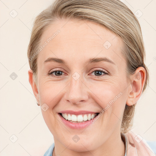 Joyful white young-adult female with medium  brown hair and blue eyes