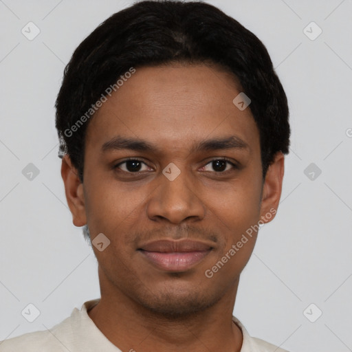 Joyful black young-adult male with short  black hair and brown eyes