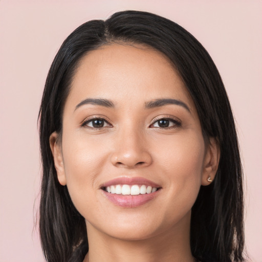 Joyful white young-adult female with long  black hair and brown eyes