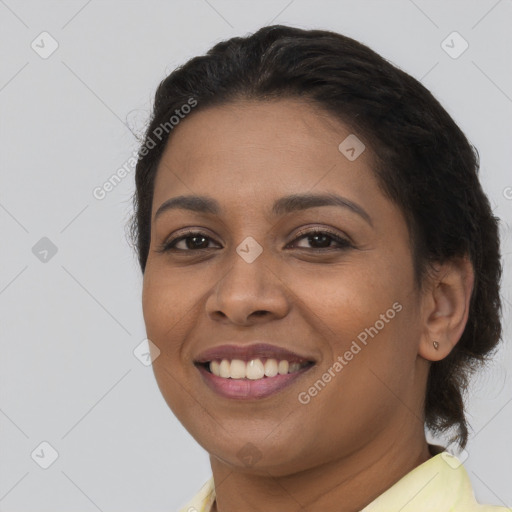 Joyful latino young-adult female with long  brown hair and brown eyes