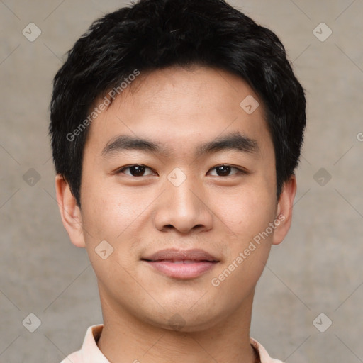 Joyful asian young-adult male with short  black hair and brown eyes