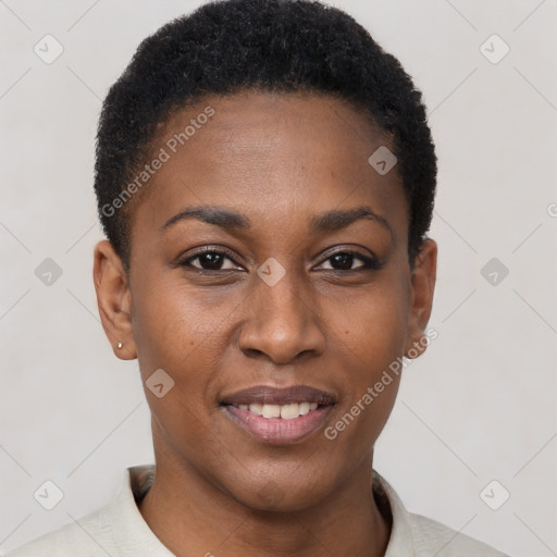 Joyful black young-adult female with short  black hair and brown eyes