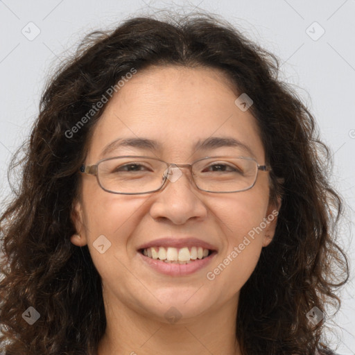 Joyful white adult female with long  brown hair and brown eyes