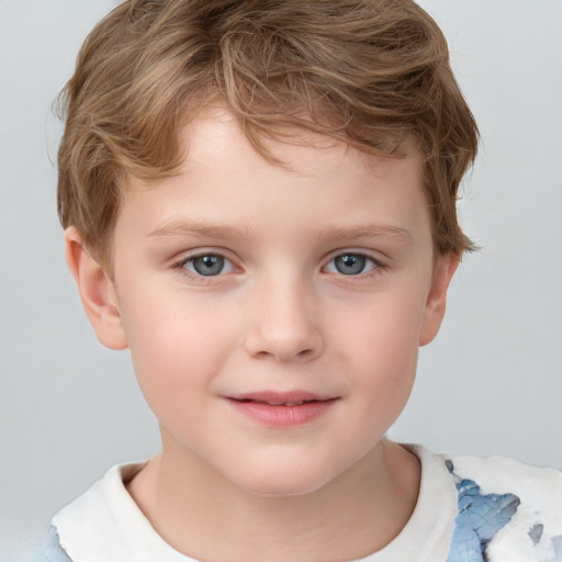 Joyful white child male with short  brown hair and grey eyes