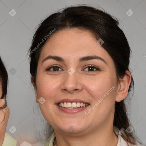 Joyful white adult female with medium  brown hair and brown eyes