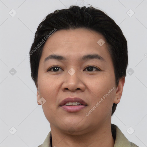 Joyful asian young-adult female with short  black hair and brown eyes