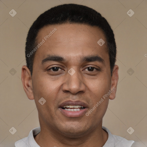 Joyful latino young-adult male with short  black hair and brown eyes