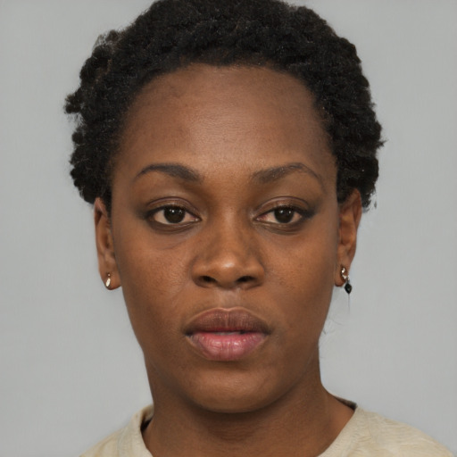 Neutral black young-adult female with short  brown hair and brown eyes