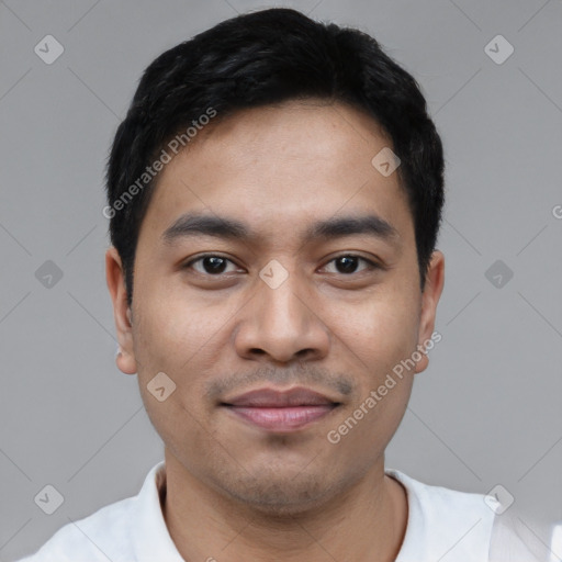 Joyful latino young-adult male with short  black hair and brown eyes