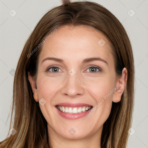 Joyful white young-adult female with long  brown hair and grey eyes