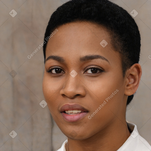 Joyful black young-adult female with short  black hair and brown eyes