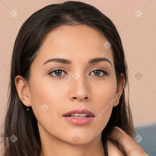 Neutral white young-adult female with long  brown hair and brown eyes