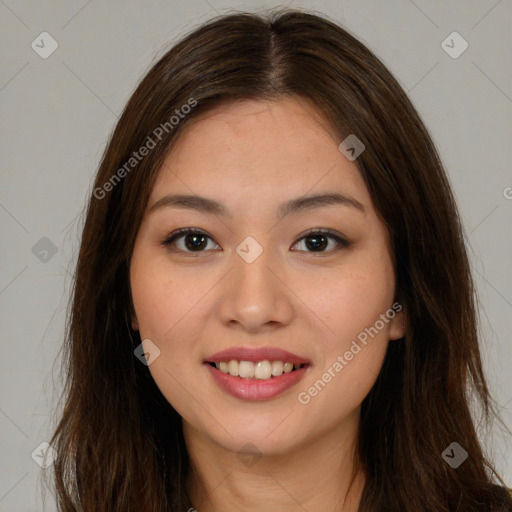 Joyful asian young-adult female with long  brown hair and brown eyes